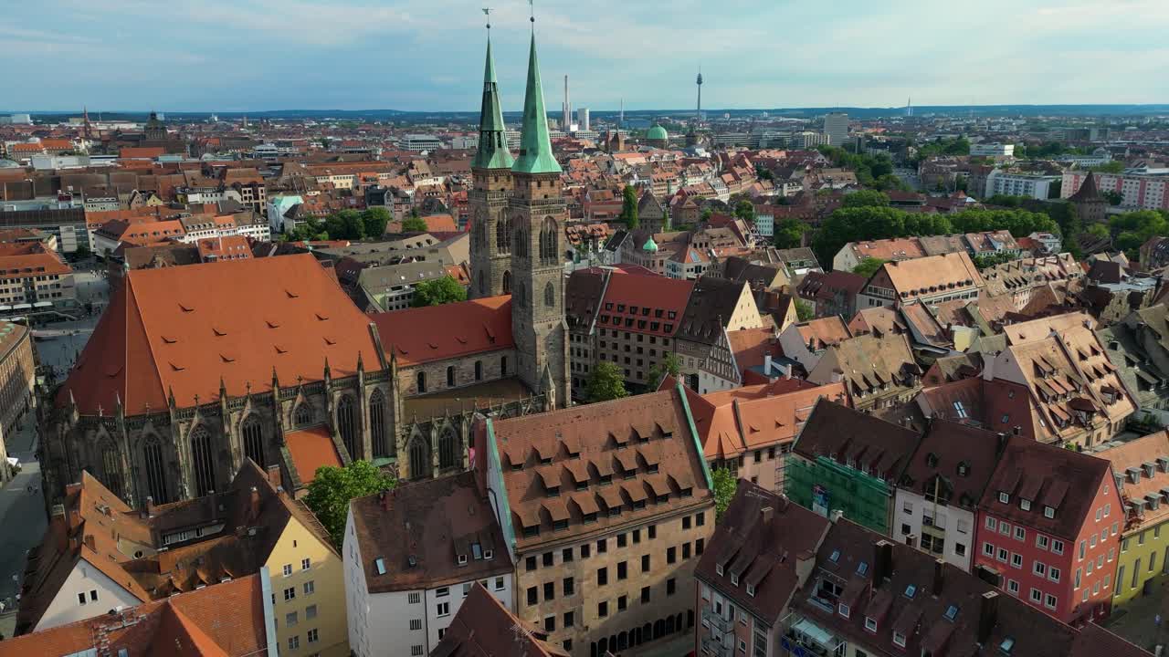 4K Aerial Drone Video of the Twin Spiers and Stained Glass Windows of the Beautiful St. Sebald Church in Downtown Nurnberg, Germany