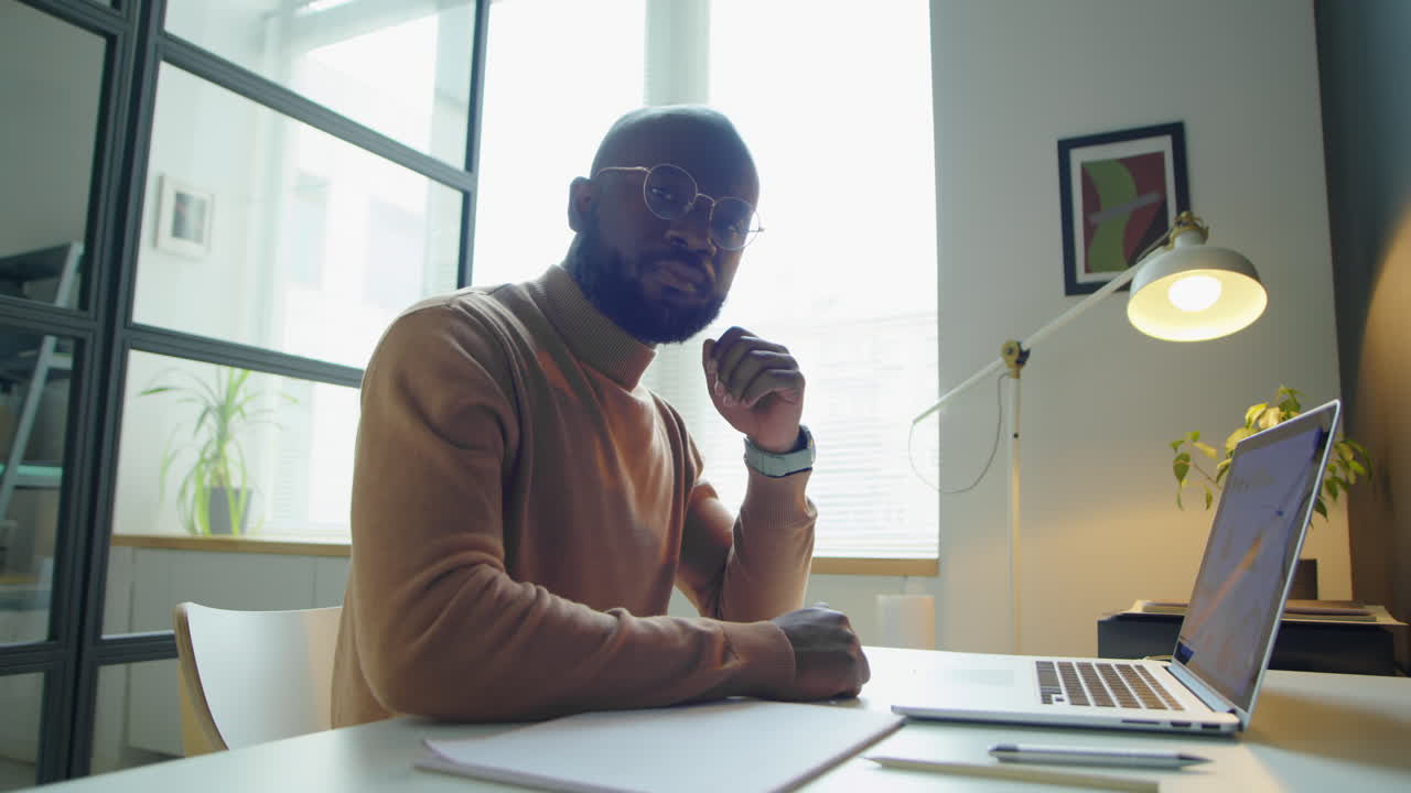 Portrait of African American Businessman at Office Desk