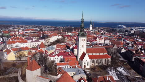 beautiful old town of tallinn aerial, baltic sea ferries in background