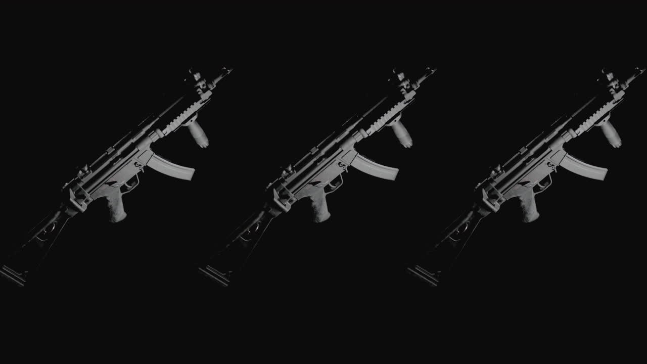 Machineguns on the dark background rotate in slowmotion