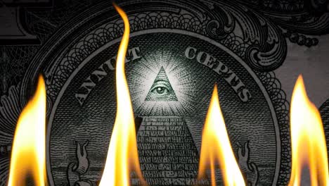 pyramid on a banknote of 1 us dollars bill with glowing freemasons eye on top on fire in flames. conceptual 4k slow motion raw video. financial crisis idea, conspiracy theory.