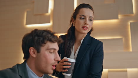 focused man working office closeup. secretary woman bringing hot coffee to boss