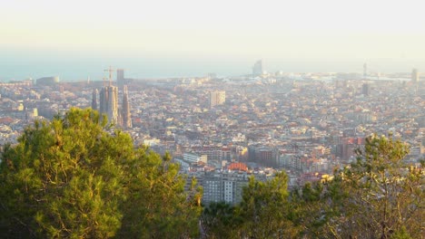 handheld shot looking down at the city of barcelona on a bright day