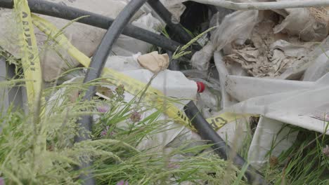 cinematic close up of garbage rubbish at a scrap yard dump