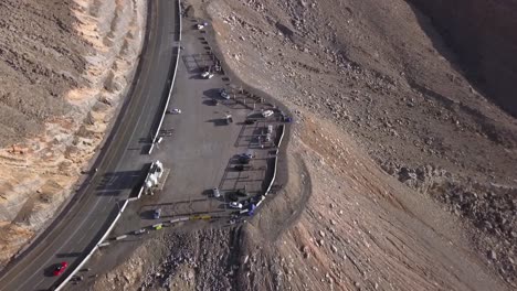 People-enjoying-the-beautiful-scenery-from-the-Jebel-Jais-mountain-in-Ras-Al-Khaimah,-UAE---Aerial-shot