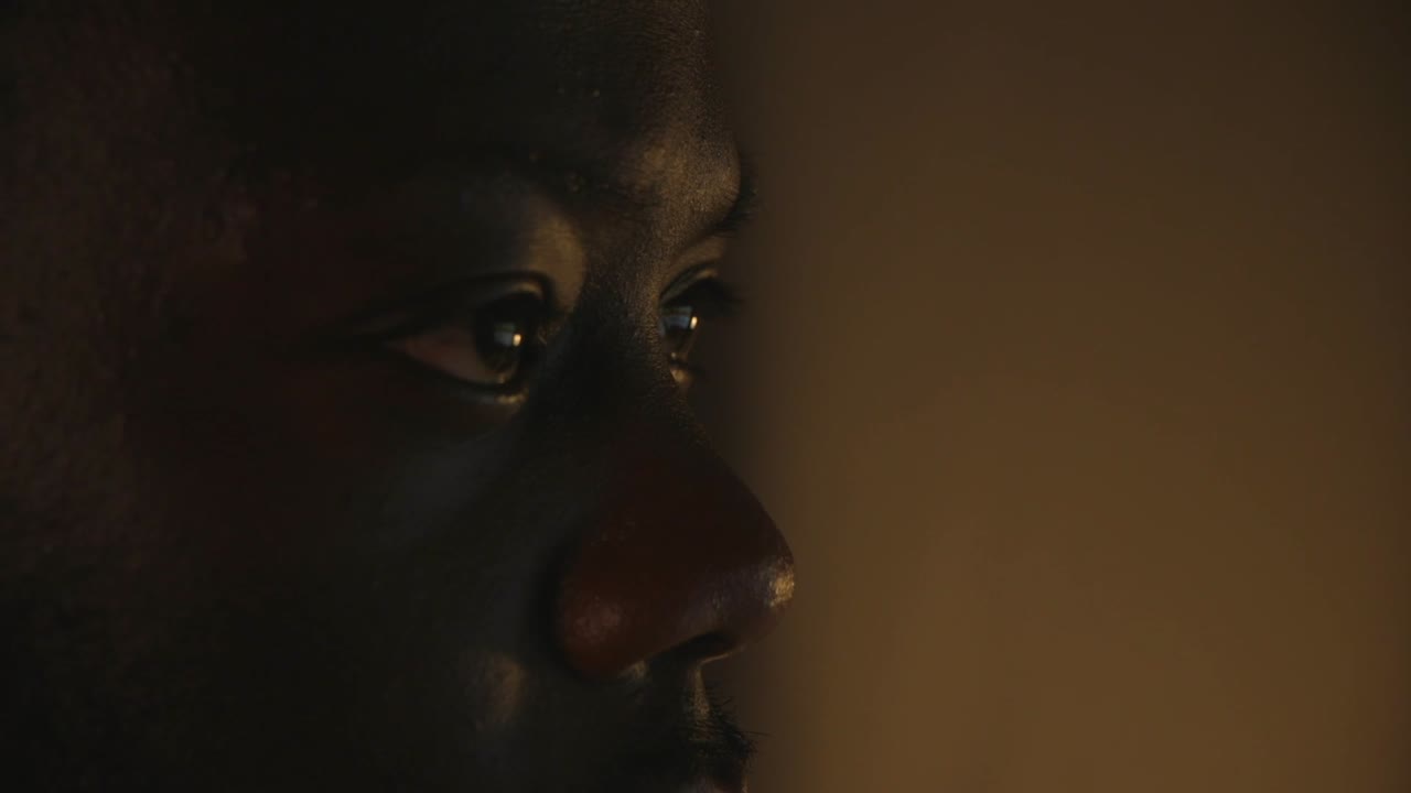 Close Up Of Black Male Eyes Looking At Computer Screen