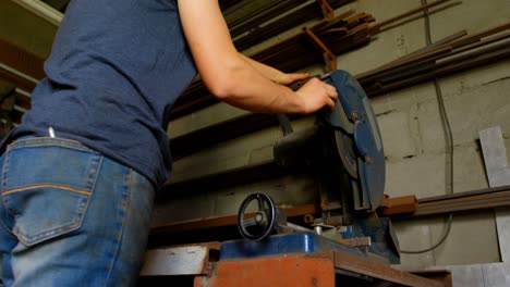 metalsmith using machine in factory 4k