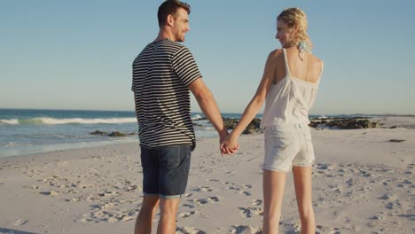 young adult couple relaxing by the sea 4k