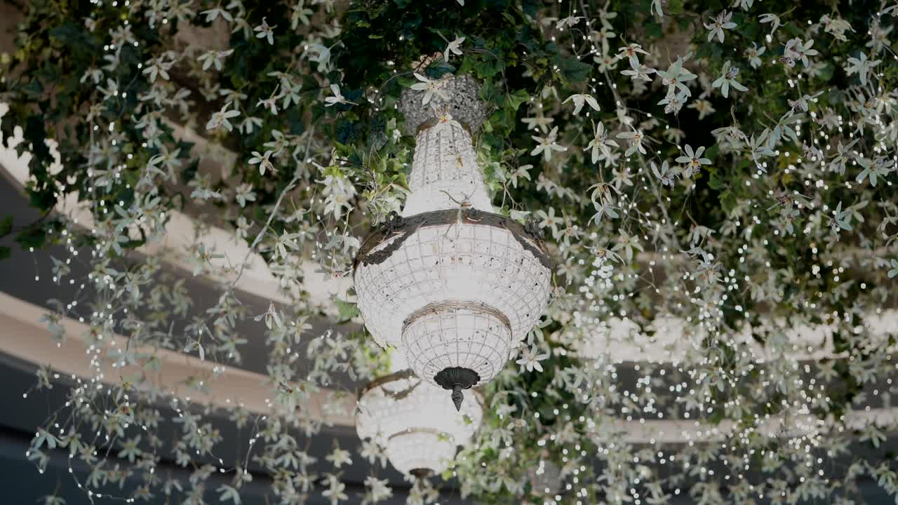 hanging chandeliers with floral ceiling and lights