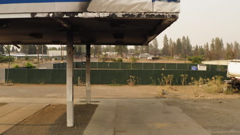 Deserted-abandoned-gas-station-ruins-damaged-and-falling-apart