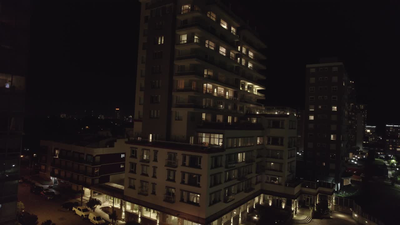 City of Mar del Plata at night in Argentina. Aerial view of urban tall buildings and park.
