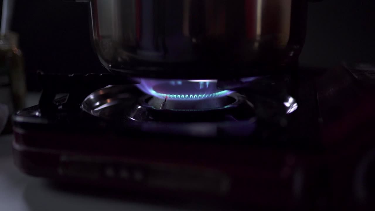 Saucepan on gas burner in kitchen