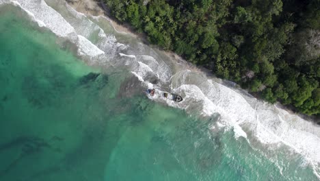 aerial birds eye shot of a shipwreck near manzanillo, costa rica. high angle, spinning shot