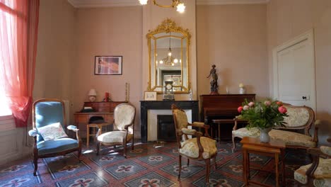 slow establishing shot of an antique living room with pattern flooring in a villa