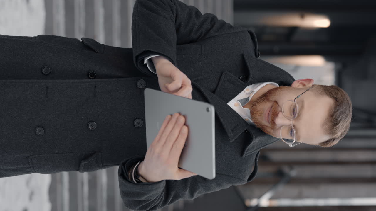 Man using tablet in winter
