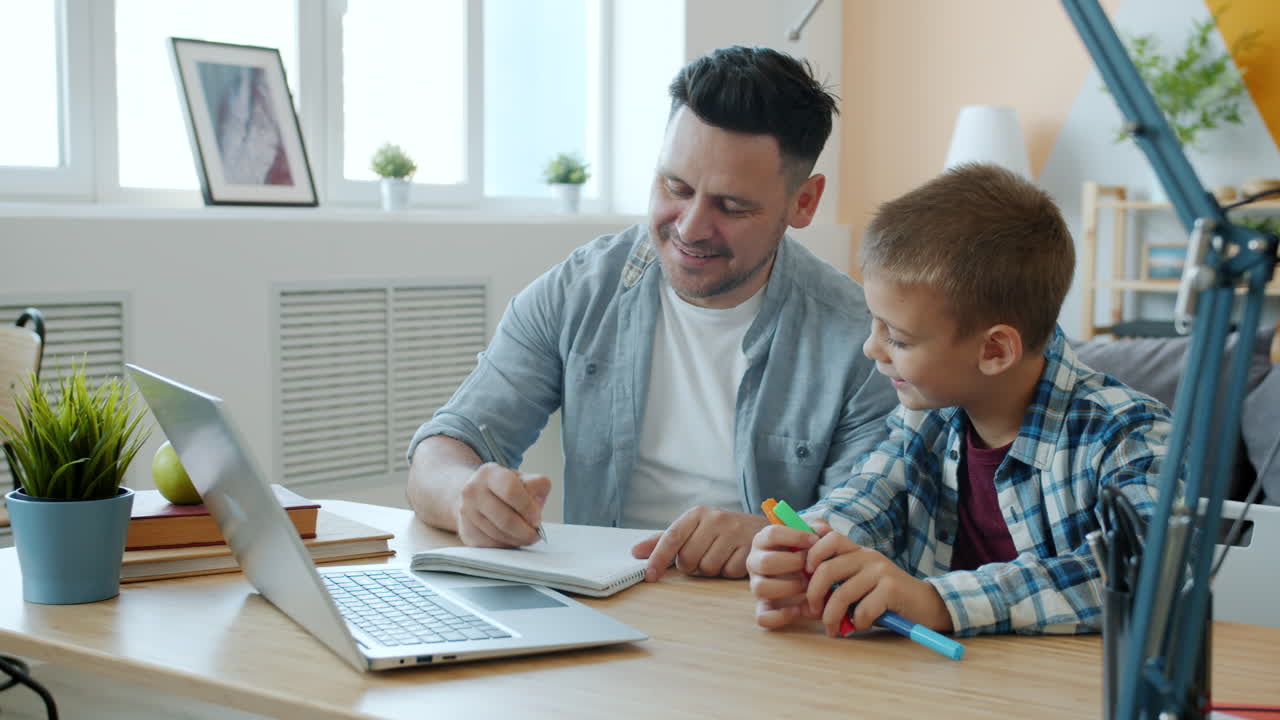 Father and Son Studying Together at Home