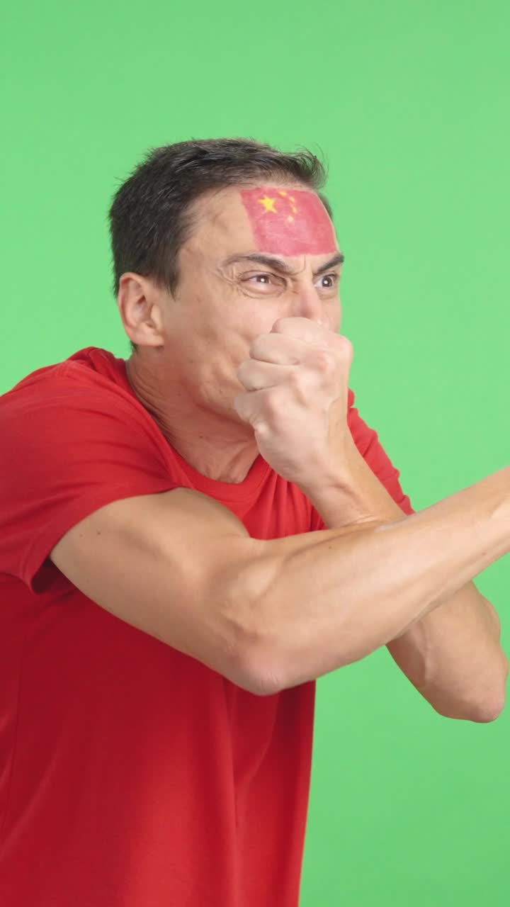 Man cheering for China, angry with the decision of referee