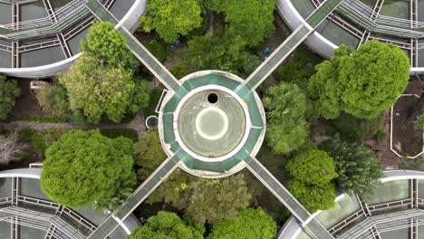 drone aerial view of sewage water treatment plant with storage tanks, trees