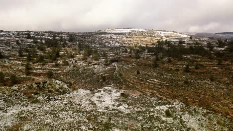 snowy mountain landscape with terraced fields