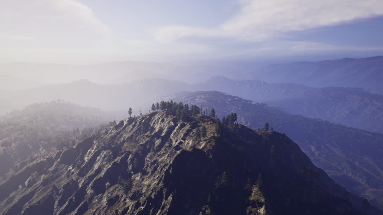 Majestic mountain landscape at dawn revealing misty valleys and trees