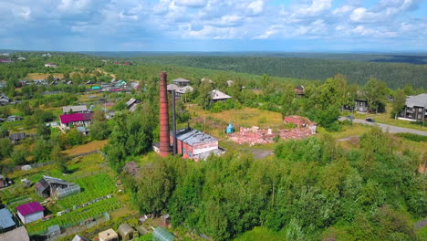 aerial view of an abandoned factory in a rural village