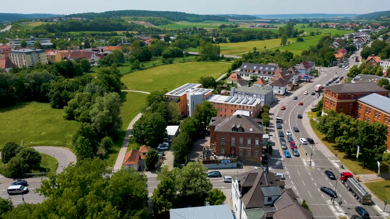 4K Aerial Drone Video of Businesses along the Frankische Rezat River in Ansbach, Germany