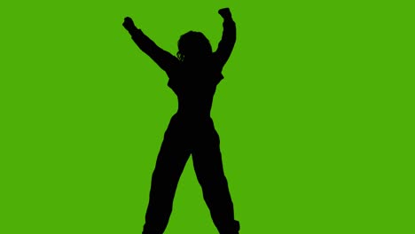 studio silhouette of woman dancing against green background 2