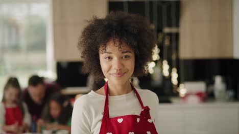 handheld video shows of beautiful african woman in the kitchen