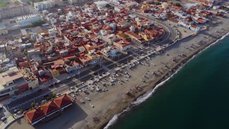 Drone-shot-following-the-coast-line-of-Linea-De-La-Concepcion,-in-Spain-near-Gibraltar