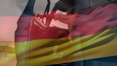 Animation-Einer-Deutschen-Flagge,-Die-über-Einem-Afroamerikanischen-Mann-Weht,-Der-Am-Strand-In-Einen-Pick-up-Truck-Steigt