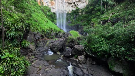 cascading waterfall surrounded by lush greenery