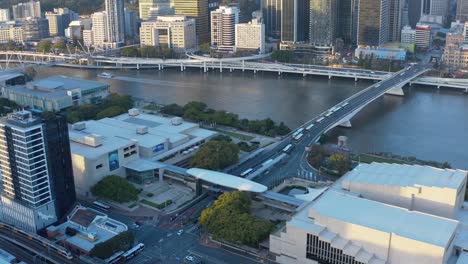 drone shot over west end, looking at south bank cultural centre busway, and the william jolly bridge