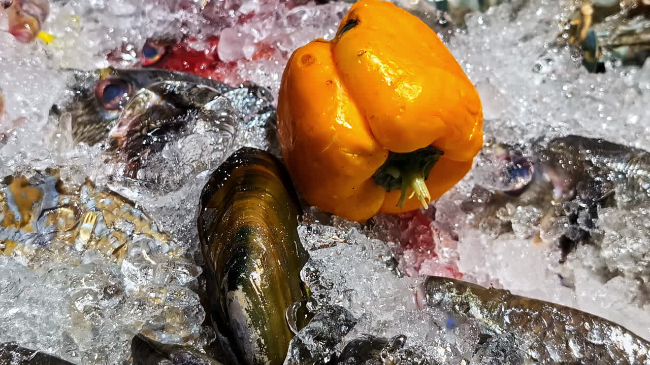 Fish and seafood under ice in a supermarket. Close up