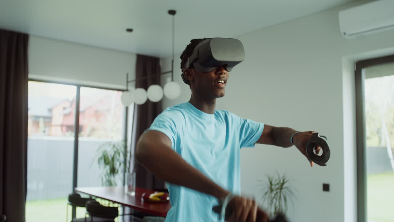 A man is using virtual reality in his home