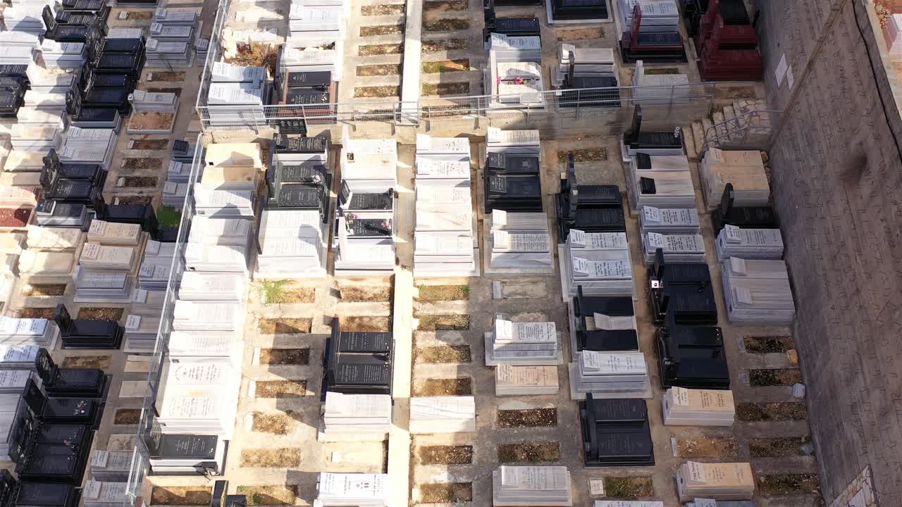 Aerial view of a large cemetery with numerous gravestones