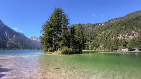 tranquil summer breeze at lake of raibl, italian julian alps