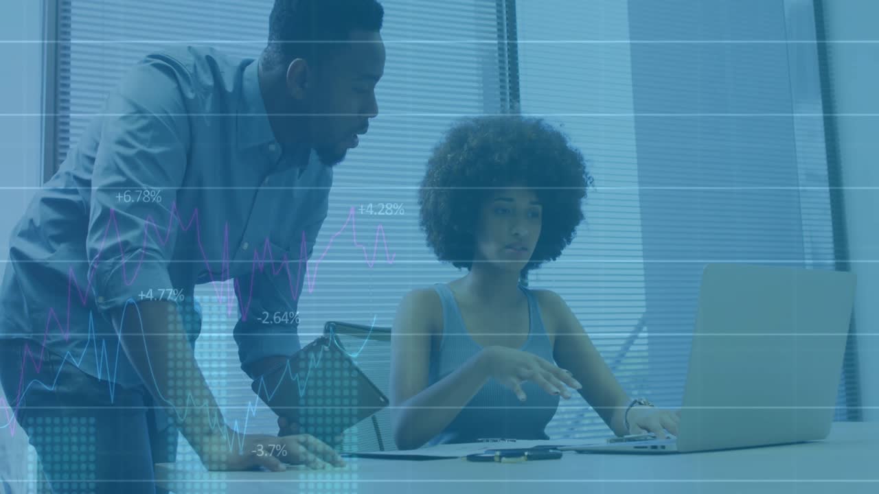 Woman writing report, man pointing document initiating financial chart overlay reviewing metrics