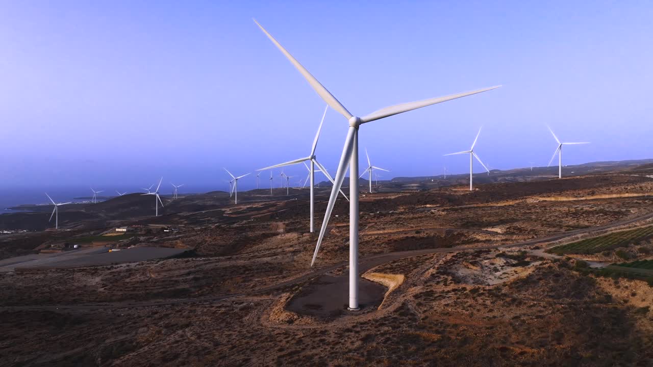 Wind turbines in Fasnia, Tenerife at dawn create a peaceful energy scene