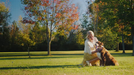 active woman plays with a dog in the park