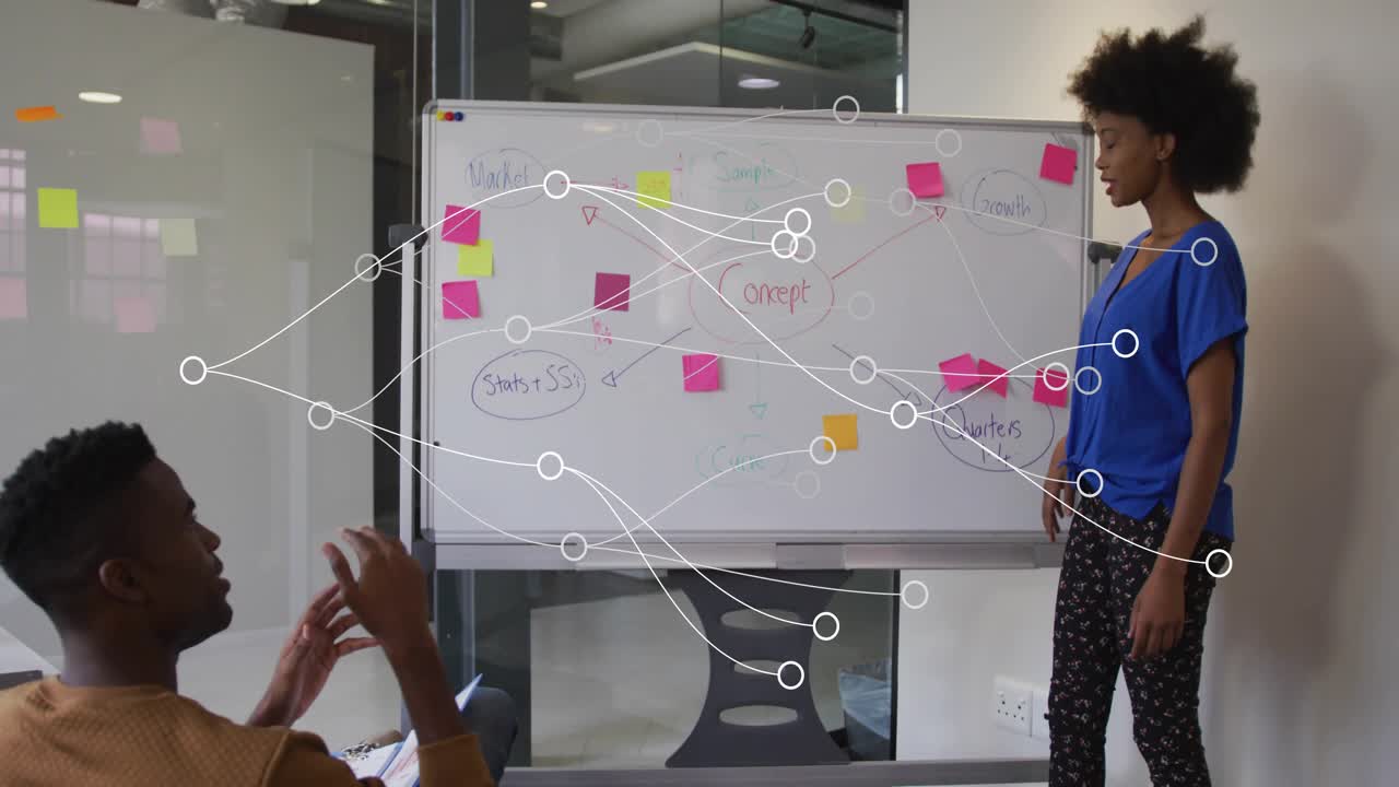 Presenter lifting marker and tapping whiteboard illustrating marketing growth strategy and planning