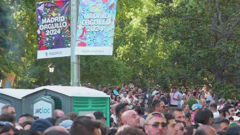 a street sign showcasing gay pride month is seen above participants as they take part in the lgbtqia pride month parade, to stand against lgbti discrimination.