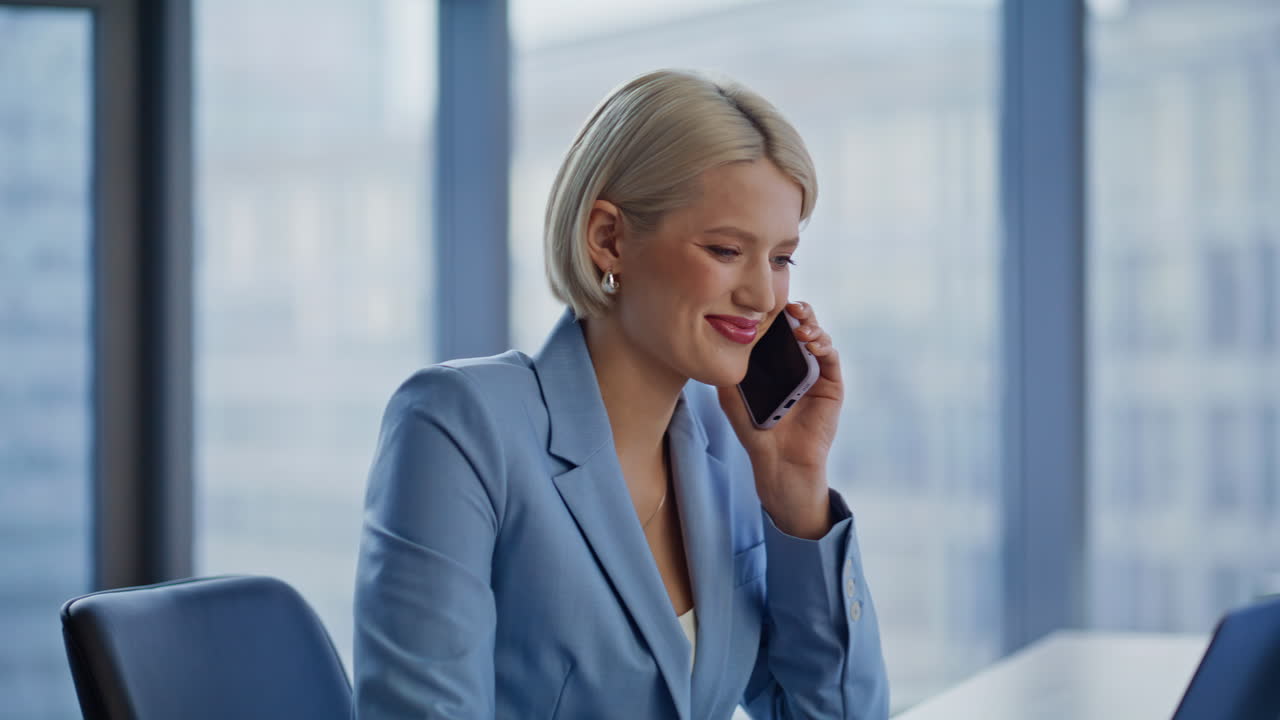 Corporate colleagues talking phones at desk closeup. Man woman smartphone calls