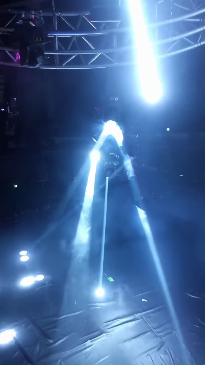 Dynamic overhead shot of stage lights creating a futuristic vibe, perfect for a music video