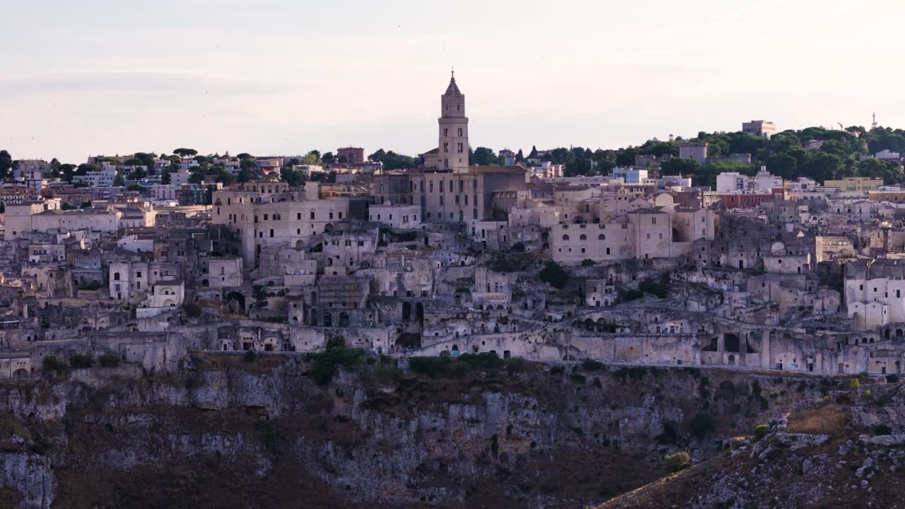 Cityscape of Matera, aerial telephoto zoom orbit view