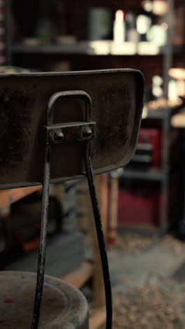 rusty metal chair in a workshop