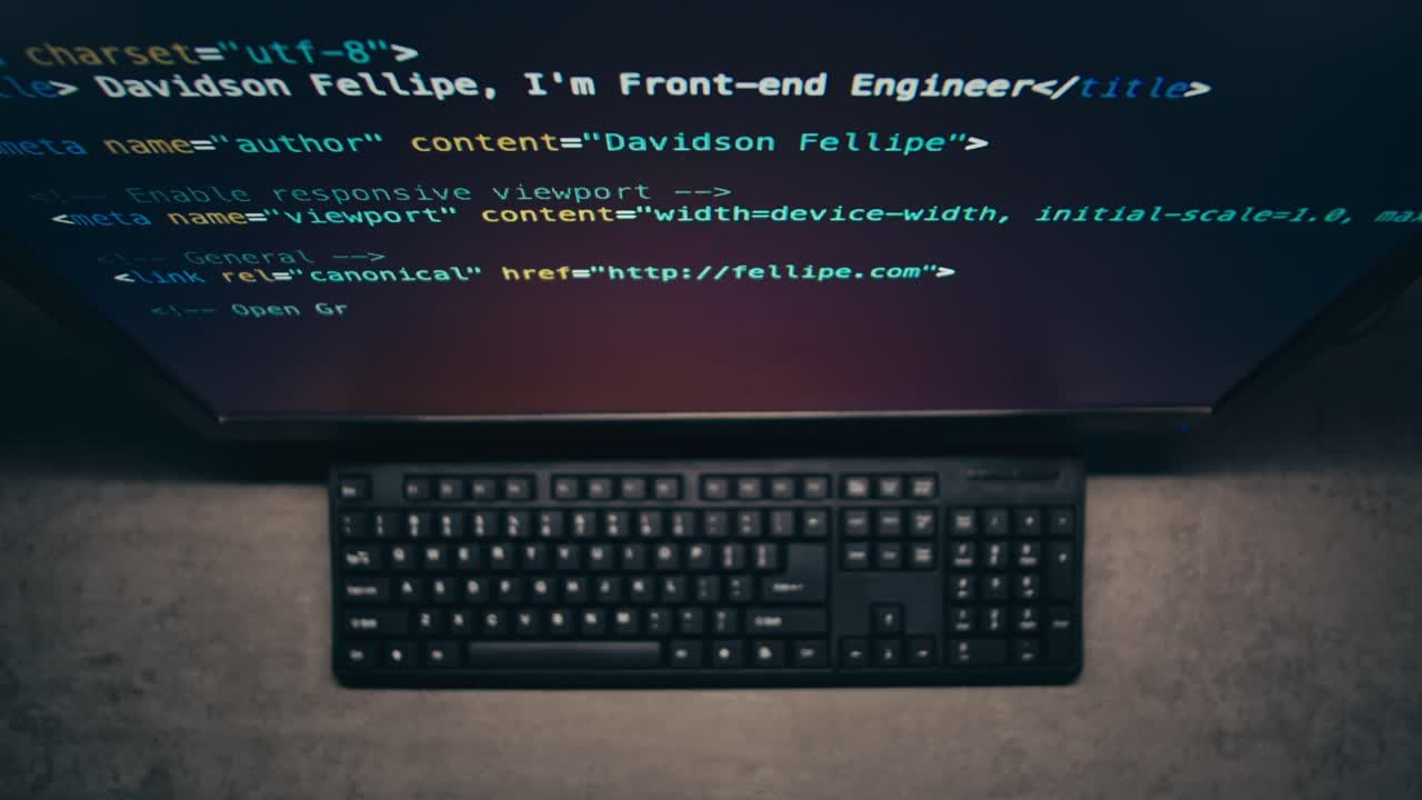 Computer Screen Showing Code and Keyboard