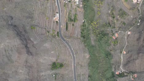 Cars-driving-on-a-highway-in-Gran-Rey-valley,-La-Gomera,-Canary-Islands