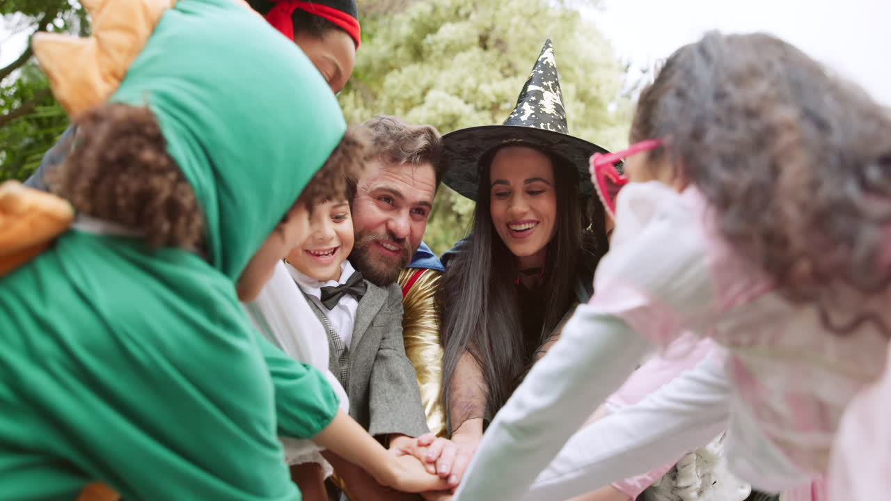 Group of People in Halloween Costumes Celebrate Together