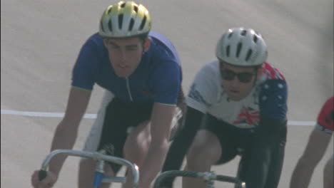 bicyclists compete on a circuit track