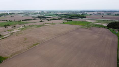 drone flying over farmers fields in rural east gwillimbury outside of toronto
